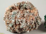 two different colored rocks sitting next to each other on a table