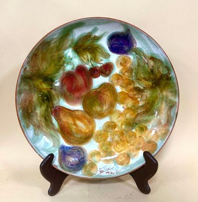 a plate with a bunch of different colored flowers on it