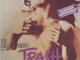 l'affiche du film « Trash », mettant en scène un homme aux cheveux longs et portant des lunettes