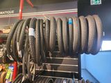 a lot of tires on a rack in a store