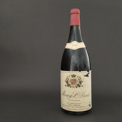 a bottle of wine that is sitting on a table