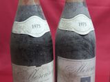 three bottles of wine sitting next to each other on a table