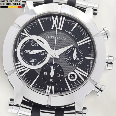 a close up of a watch with a black face