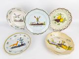 several plates with different designs and designs on them on a white surface