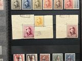 an open book with a bunch of different stamps on it