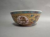 a bowl with a design on it sitting on a table