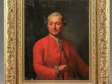 an old painting of a man in a red coat is on a easel