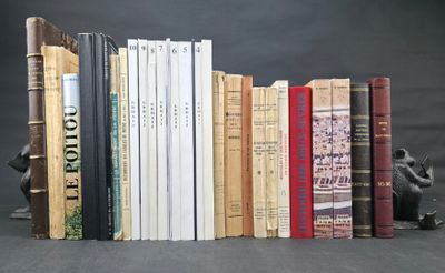 a lot of books that are sitting on a table