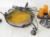 a bowl with candles and a candle holder on the table