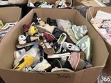 many boxes of shoes that are sitting in the floor