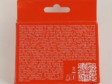 an orange box with a qr code on it sitting on top of a white surface