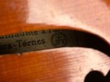 an image of a close up of a violin with a label on it