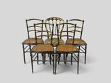 a set of four chairs with cane backrests and cane backrests