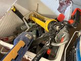a bucket full of tools sitting on the floor