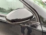 a close up of a car ' s side mirror on the side of the car