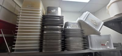 many plates stacked on top of each other in a kitchen