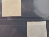 two pieces of paper sitting on top of a plastic container