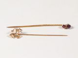 pair of gold plated hair pins with garnets and garnets