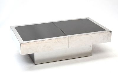 une photo d'une table basse moderne avec un plateau en verre