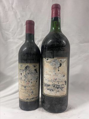 two bottles of wine sitting next to each other on a white surface