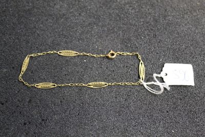 a close up of a chain with a tag attached to it