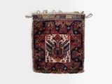 an old rug hanging on a wall on a white background