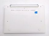 a white laptop with a blue sticker on the back of it