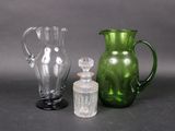 three glass vases sitting next to each other on a table