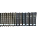 a lot of books that are lined up on a shelf