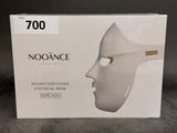 a box with a white mask on top of it