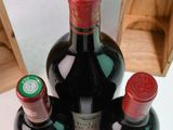 three bottles of wine sitting next to each other on a table