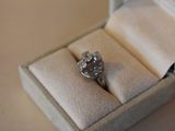 a ring that is sitting in a box on a table