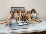 a bunch of dolls that are sitting on a table