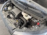 the engine of a car with its hood open and the hood down