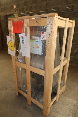 a wooden crate that has a glass door on top of it