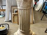 an image of a stone pedestal in a room