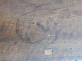 a wooden table with a smiley face drawn on it