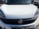 the front end of a white fiat suv parked in a parking lot