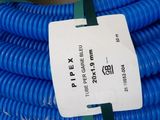 a close up of a blue hose with a tag on it