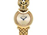 a close up of a wrist watch with a gold bracelet