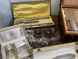 a table with silverware on it and a case on the table