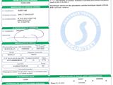 a green and white document with a barcode on it