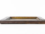 an old wooden tray on a white surface with a white background