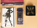a picture of a purse, scissors, scissors, and other items laid out on a table