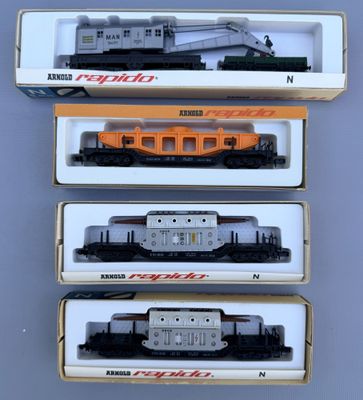 three boxed trains are sitting in a box on a table