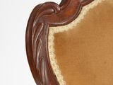 a brown chair with a tan upholstered back and a brown seat
