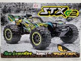 une image représentant un monster truck miniature dans une boîte