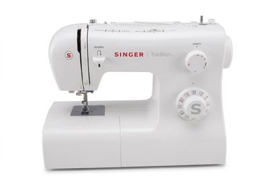 the white singer sewing machine is sitting on a white surface
