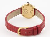 an image of a wrist watch with a red leather strap