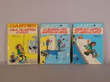 Trois livres pour enfants sont alignés sur une table